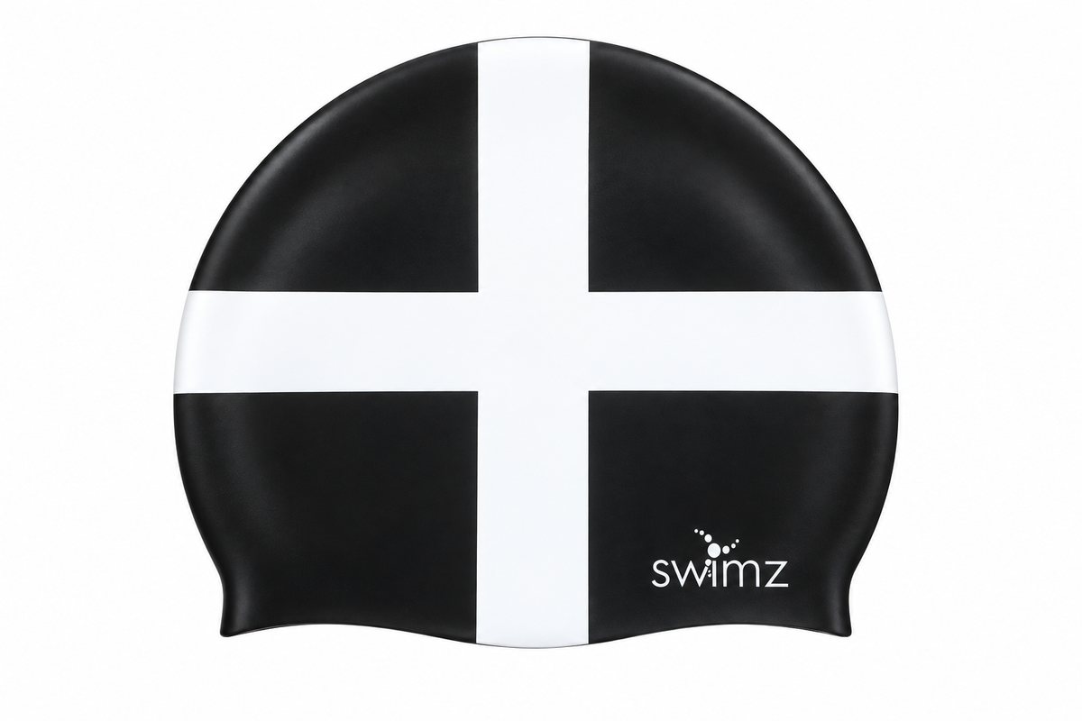 SWIMZ Cornwall flag silicone swim cap in black with a white St Piran’s cross and white SWIMZ logo.